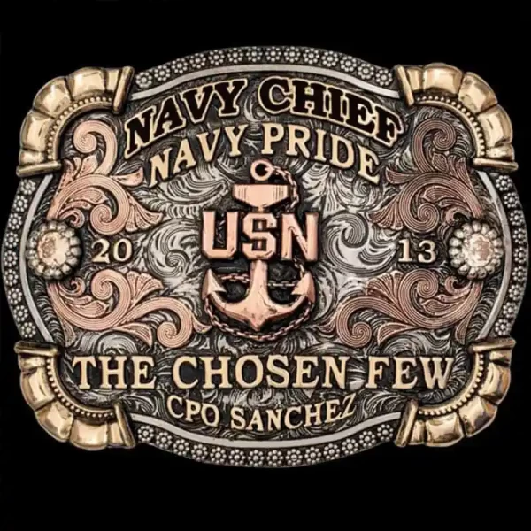 "This buckle is as tough as the sea itself. Our Everett Belt Buckle is crafted on a German Silver base with a striking three-toned metal design. This buckle features hand-engraved Copper scrollwork, beaded German Silver flowers accented with cubic zi